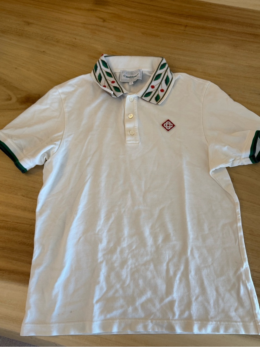 White Polo with Green-Trim Collar and Sleeve Detail